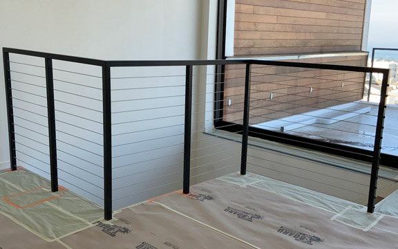 an indoor cable railing installation done by our pros